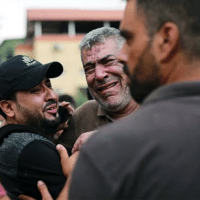 Palestinians transport the injured to the Indonesian Hospital in Jabalia, north of the Gaza Strip on October 9, 2023.